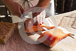 Chef preparing sol salmon fillet