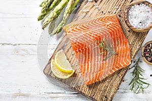 Salmon fillet with ingredients for cooking - fresh vegetables a