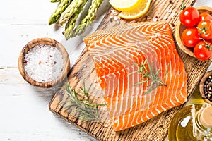 Salmon fillet with ingredients for cooking - fresh vegetables a