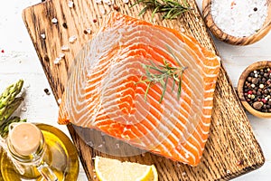 Salmon fillet with ingredients for cooking - fresh vegetables a