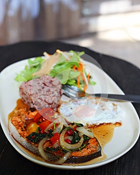 Salmon fried with basil brown rice egg and salad