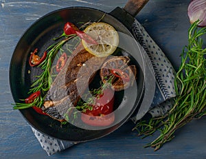 salmon fried with seasonings. with rosemary and lemon and red pepper