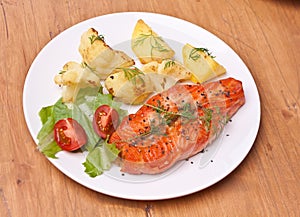 Salmon garnished with vegetables