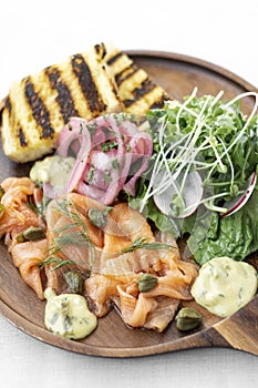 Salmon gravlax platter with salad and toast in sweden