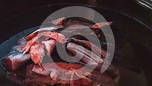 Salmon Head and Frame in a Metal Pan before Boiling. Preparing Salmon Fish Head Soup