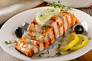 Salmon with lemon, olives and herbs