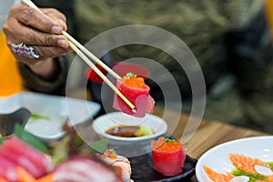 Salmon maki roll Japanese food restaurant, salmon sushi on plate. Sushi platter with a mixed variety of the Japanese delicacy at