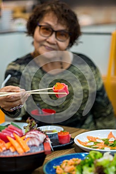 Salmon maki roll Japanese food restaurant, salmon sushi on plate. Sushi platter with a mixed variety of the Japanese delicacy at