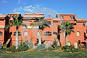 Salmon or orange apartments on Spanish urbanisation