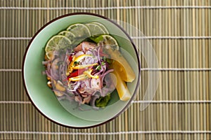 Salmon peruvian ceviche on bamboo mat