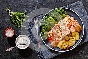 Salmon with potato and tarragon sour cream sauce