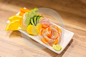 Salmon raw sashimi On a white plate in a restaurant,food japanese