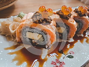 Salmon roll topped salmon roe. Sushi Maki Menu