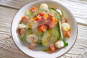 Salmon salad of mozzarella tomato cucumber