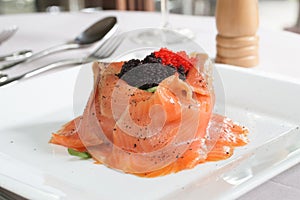 Salmon salad with rocket and caviar