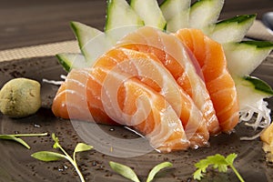 Salmon sashimi with green decoration. Japonese food