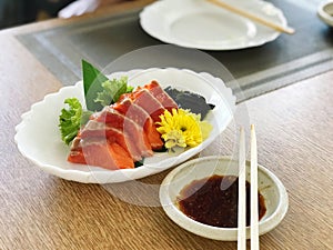 Salmon sashimi japanese food on wooden table background