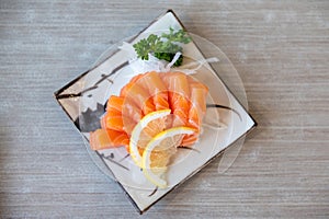 Salmon sashimi in Japanese style fresh serve on white plate