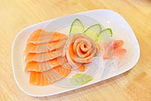 Salmon sashimi menu set Japanese cuisine fresh ingredients on plate - Japanese food raw sashimi salmon fillet with vegetable