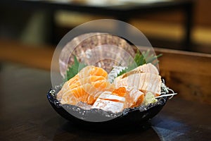 Salmon sashimi - Raw fresh and grilled salmon sliced served on i