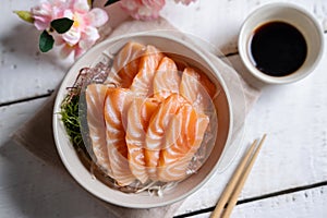 Salmon sashimi with soy sauce in traditional Japanese style