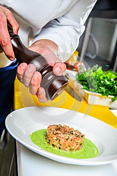 Salmon sashimi spicy salad cooking by cheef in the restaurant