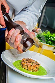 Salmon sashimi spicy salad cooking by cheef in the restaurant