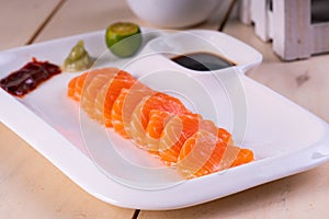 Salmon sashimi with wasabi and soy sauce