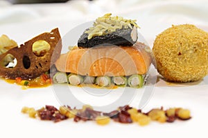 Salmon with side dishes on plate