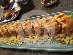 Salmon Skin Roll with mentai sauce and tempura crisp