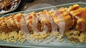 Salmon Skin Roll with mentai sauce and tempura crisp
