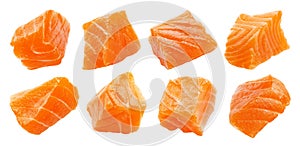 Salmon slices isolated on white background with clipping path, cubes of red fish, ingredient for sushi or salad