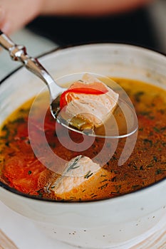 Salmon Soup With Potatoes, Carrots, Dill, Pepper In Bowl, Close Up