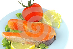 Salmon steak on blue dish