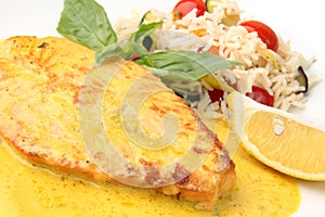 Salmon steak in a creamy saffron sauce