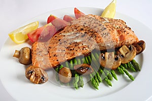 Salmon steak dinner with mushroom, asparagus,