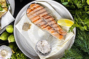 Salmon steak grilled with lemon