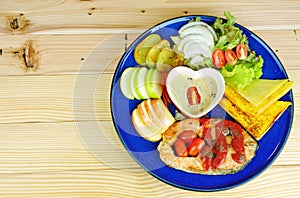 Salmon steak with side dishes in blue plate