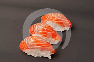 Salmon sushi on  black background