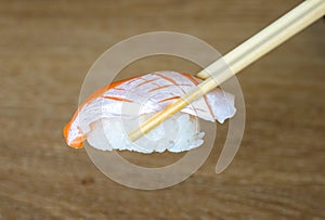 Salmon sushi on chopstick. Japanese food