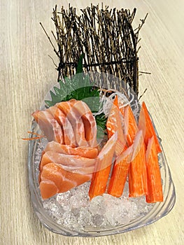 Salmon sushi Japanese food served with crab stick Kanikama on