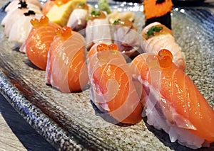 Salmon sushi Japanese food served with crab stick Kanikama on