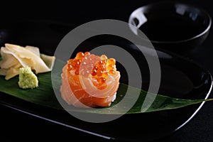 Salmon Sushi roll with caviar topping Japanese food