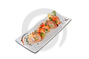 Salmon sushi roll with sauce and peper pout
