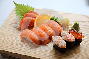 Salmon sushi and sashimi on wood plate Japanese food