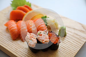 Salmon sushi and sashimi on wood plate Japanese food
