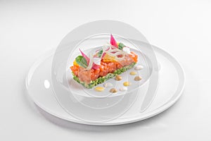 Salmon Tartar with avocado Gourmet Food Starter isolated on white background