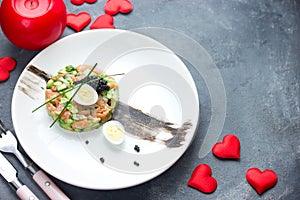 Salmon tartare with avocado black caviar and quail egg on Valentines Day , aphrodisiac food for lovers , festive delicacy