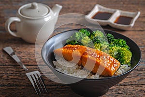 Salmon teriyaki with rice and vegetable in bowl