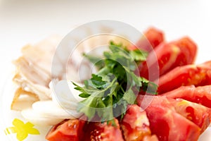 Salo tomatoes parsley onion and garlic on the table